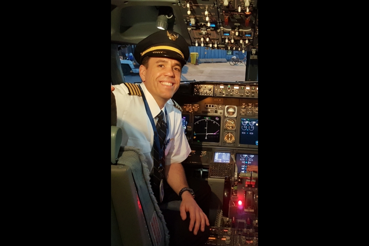 Greg Sumner, an airline captain, sits in the flight deck of a Boeing 737 aircraft.