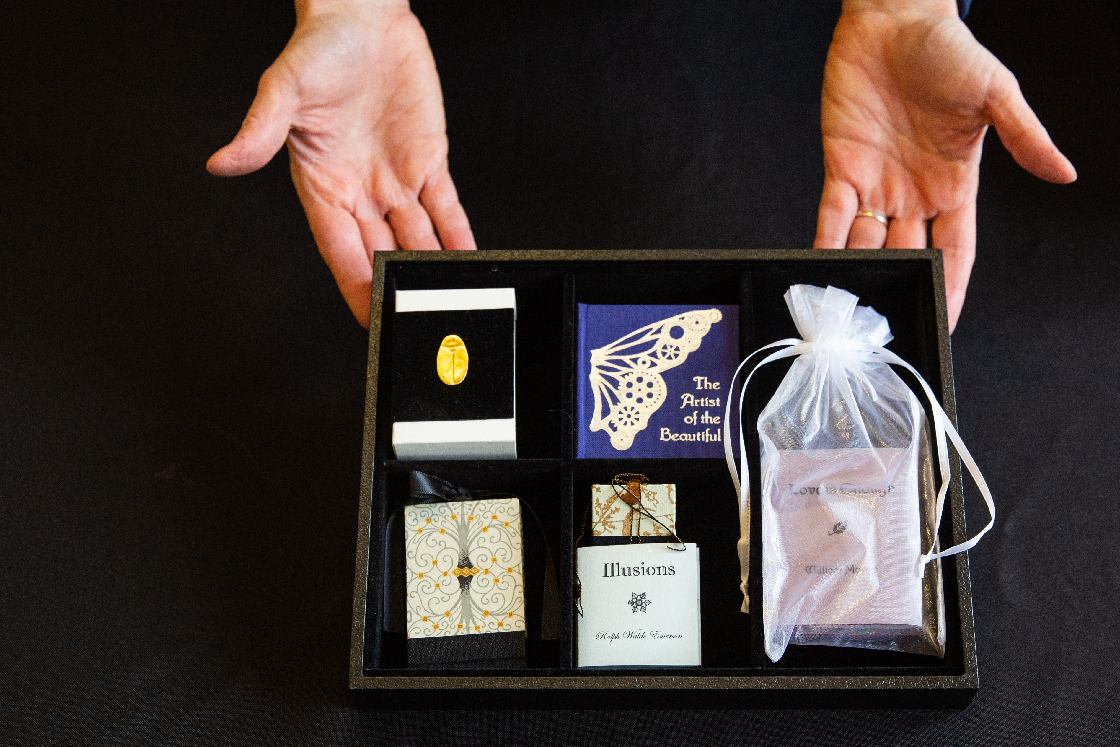 A tray of miniature books by Kelly Houle / Photo by Deanna Dent/ASU Now