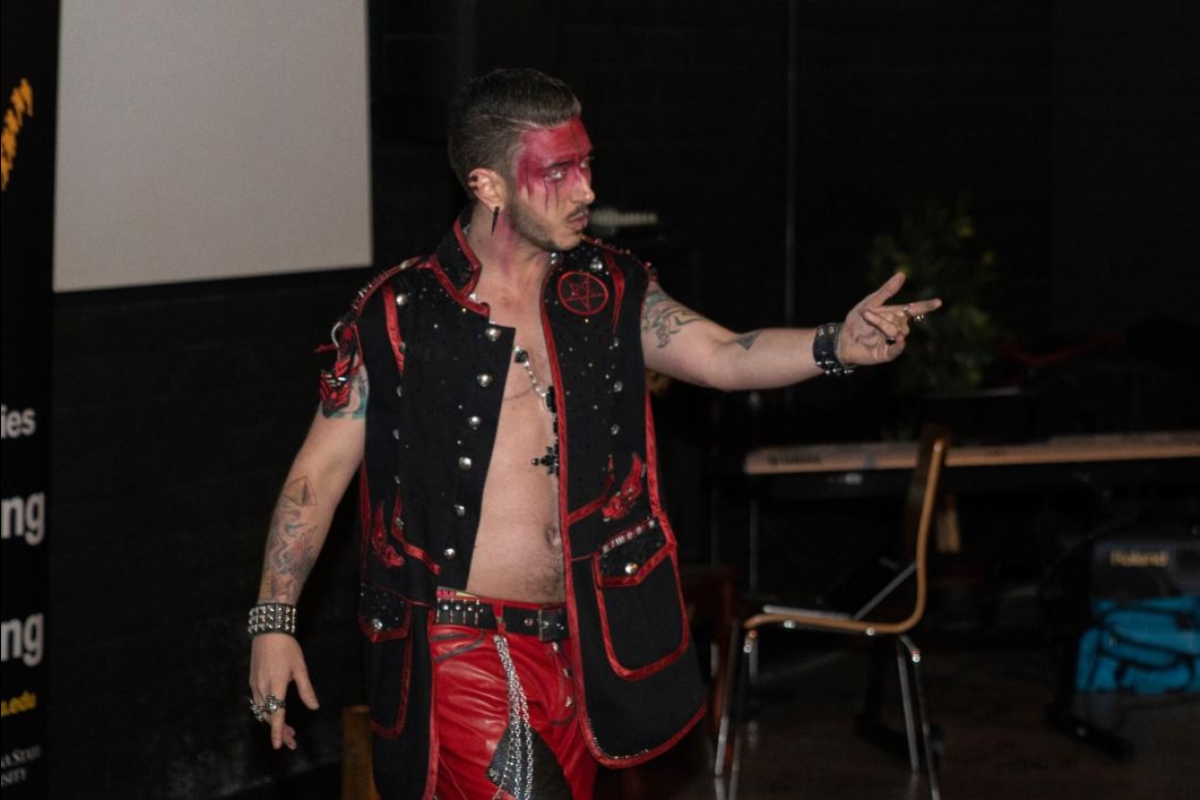 A drag king performs at a show