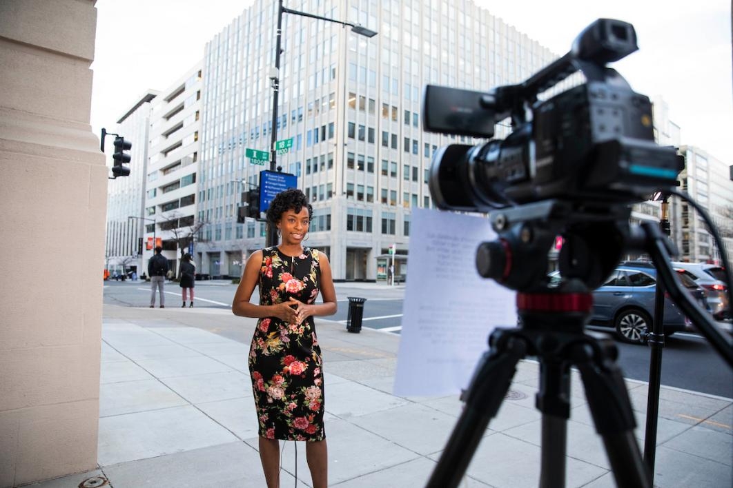 Woman in front of news camera