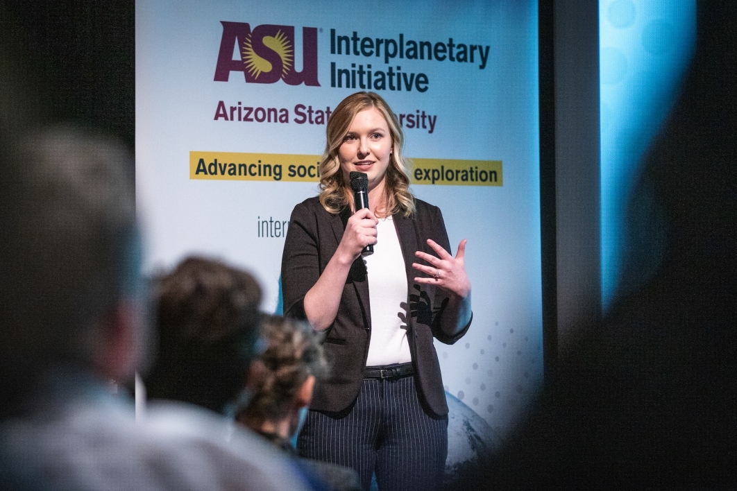 A woman speaks onstage at the ASU Space to Thrive space missions panel