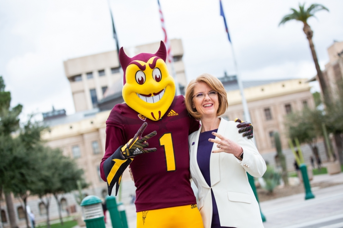Heather Carter poses for a photo with Sparky at Day at the Capitol