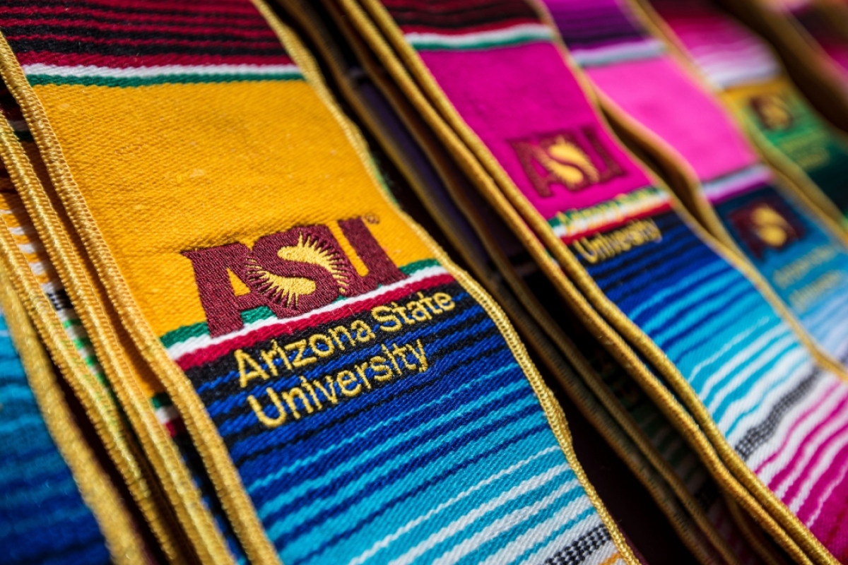 ASU Hispanic convocation stoles sit in stacks for students to use during graduation photos