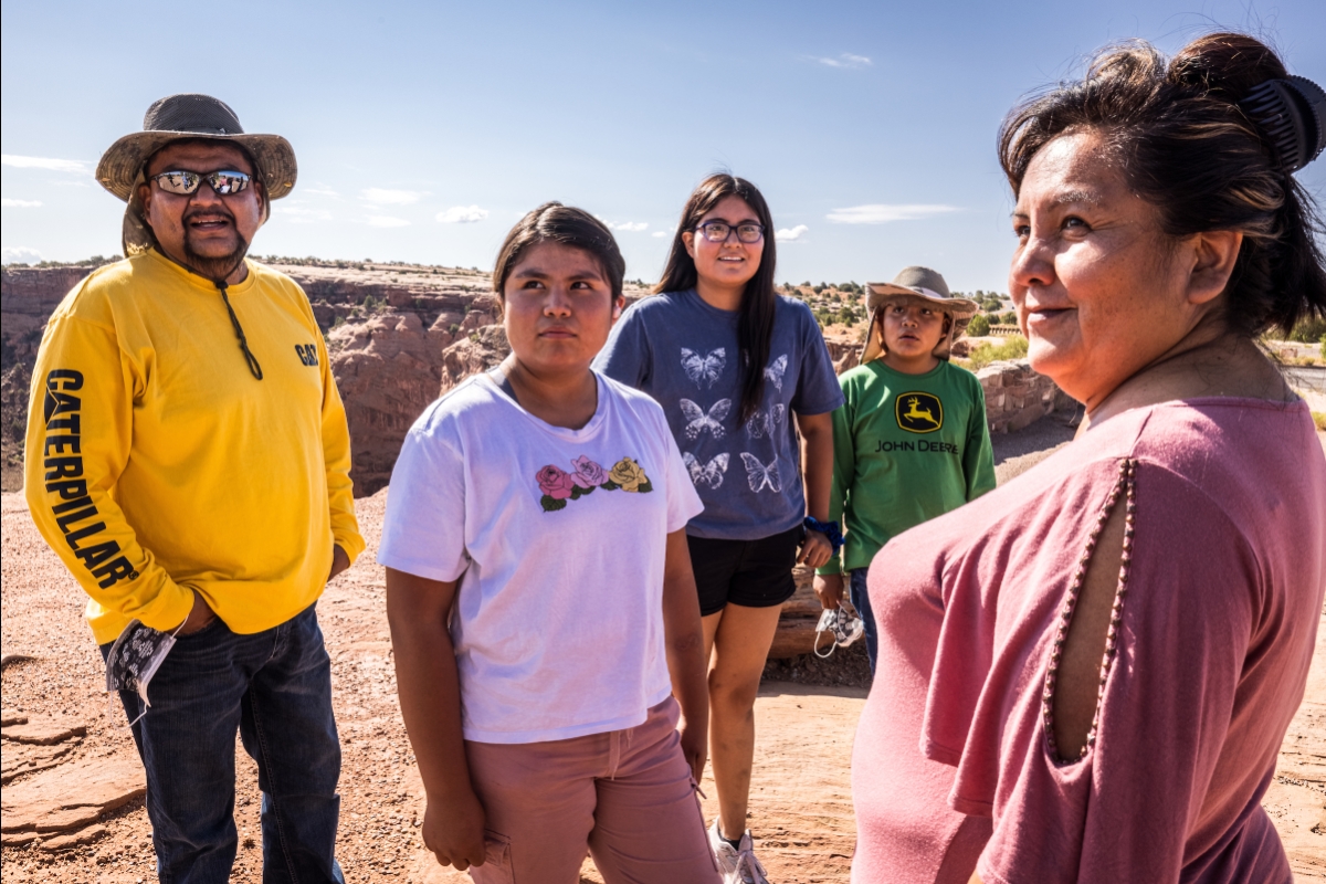 Two parents and their three kids stand near Canyon de Chelly in northern Arizona