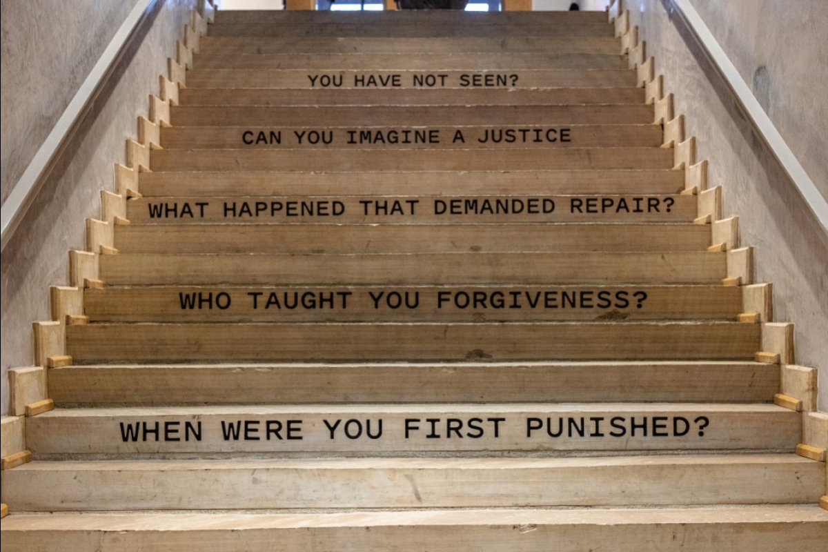 Phrases about incarceration painted on stairs
