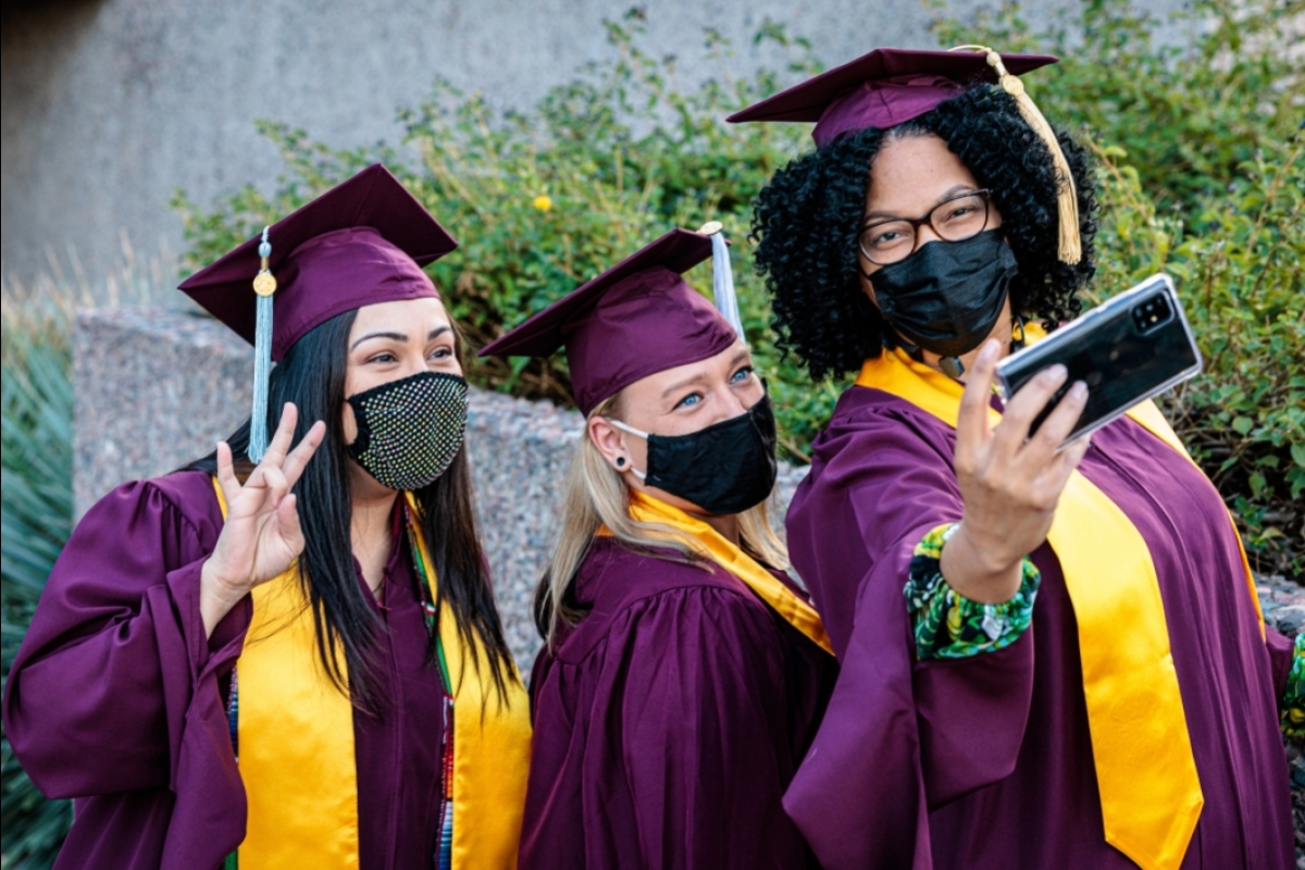 students taking photo at graduation