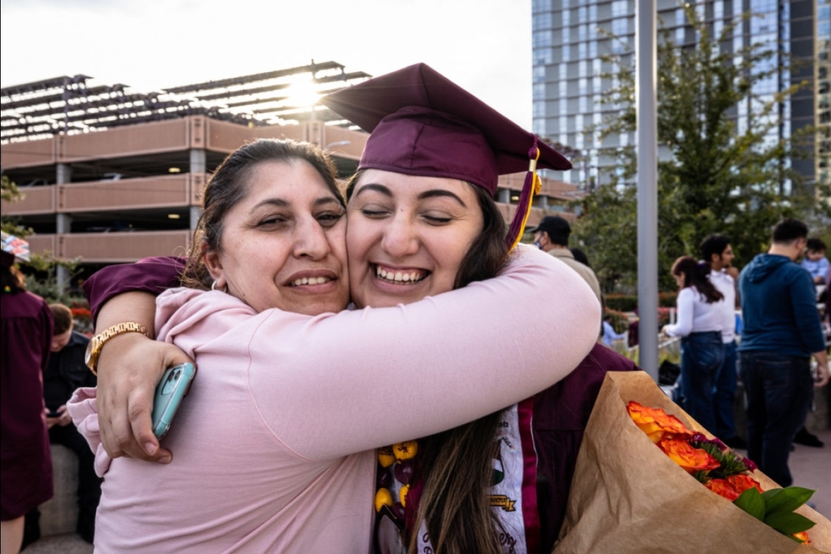 mother and daughter hugging after graduation