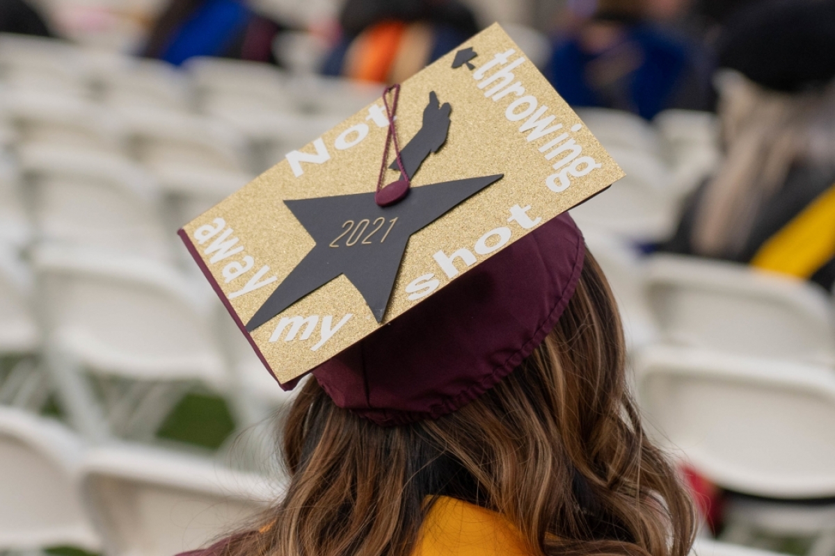 ASU graduation cap decorated with Hamilton reference
