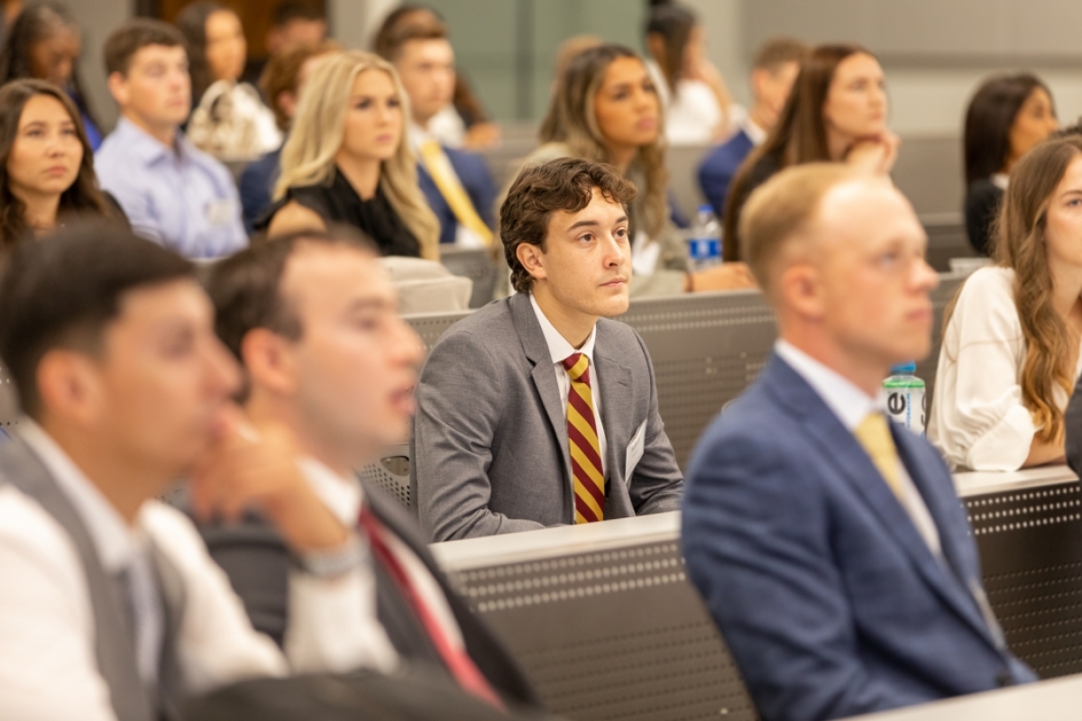 A law student listens intently during a lecture