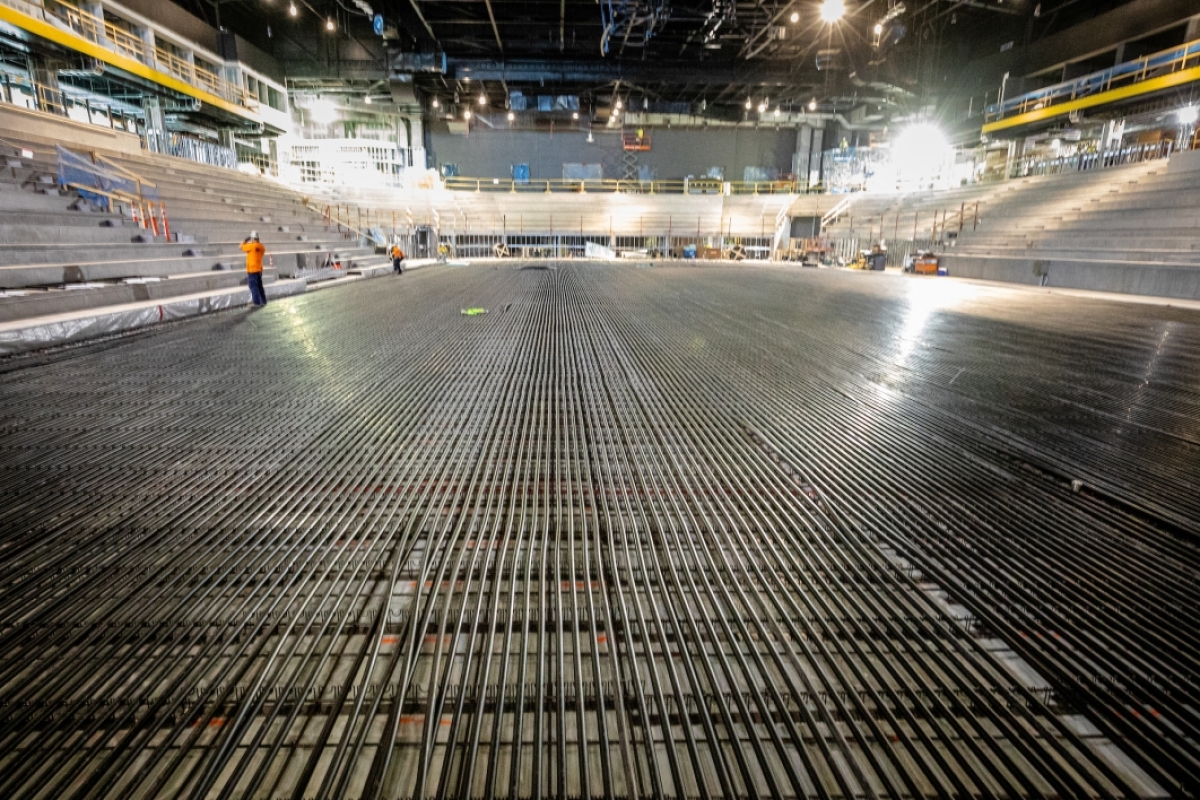A closeup of the black cooling tubes on the bottom of what will become the ice rink in the new ASU arena