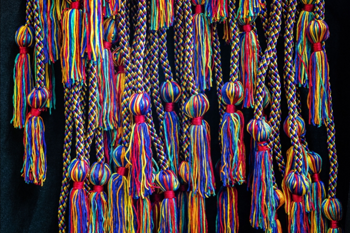 Colorful rainbow cords hand in a clump