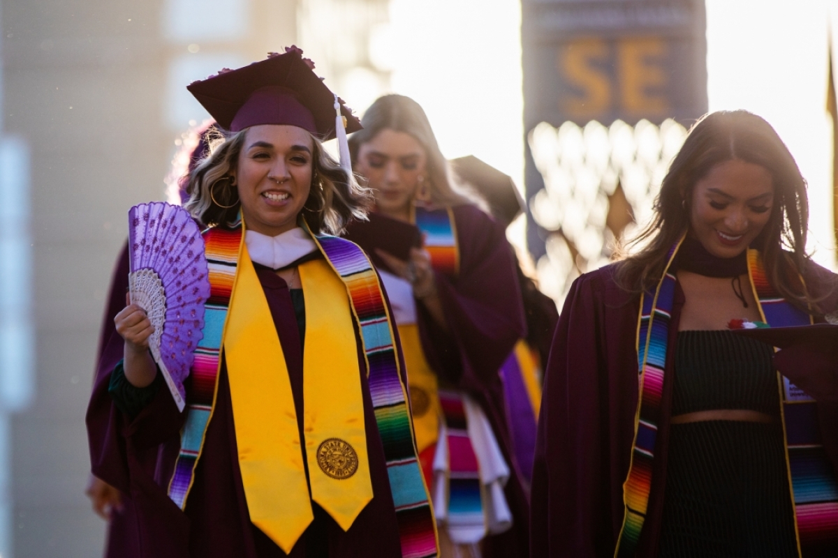 ASU graduates walking to Hispanic convocation