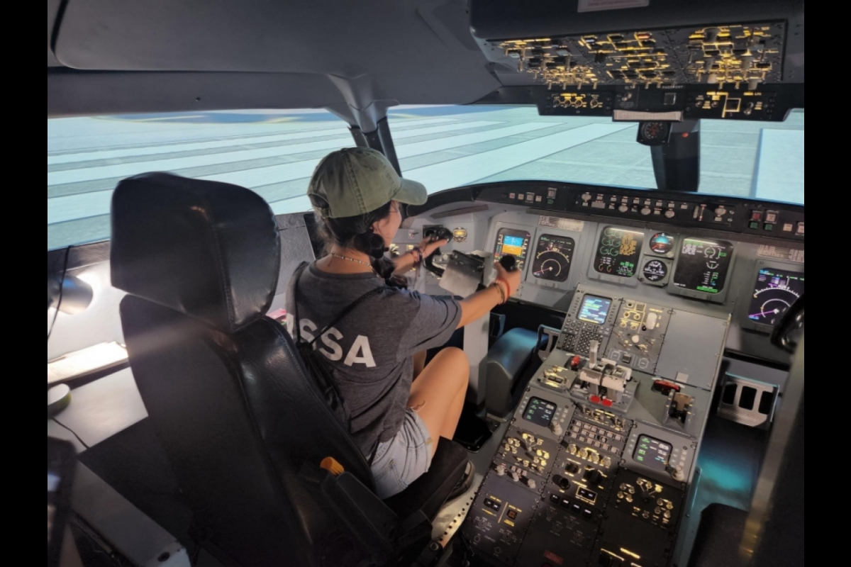 Student using the airplane simulator at the ASU Aviation Engineering school