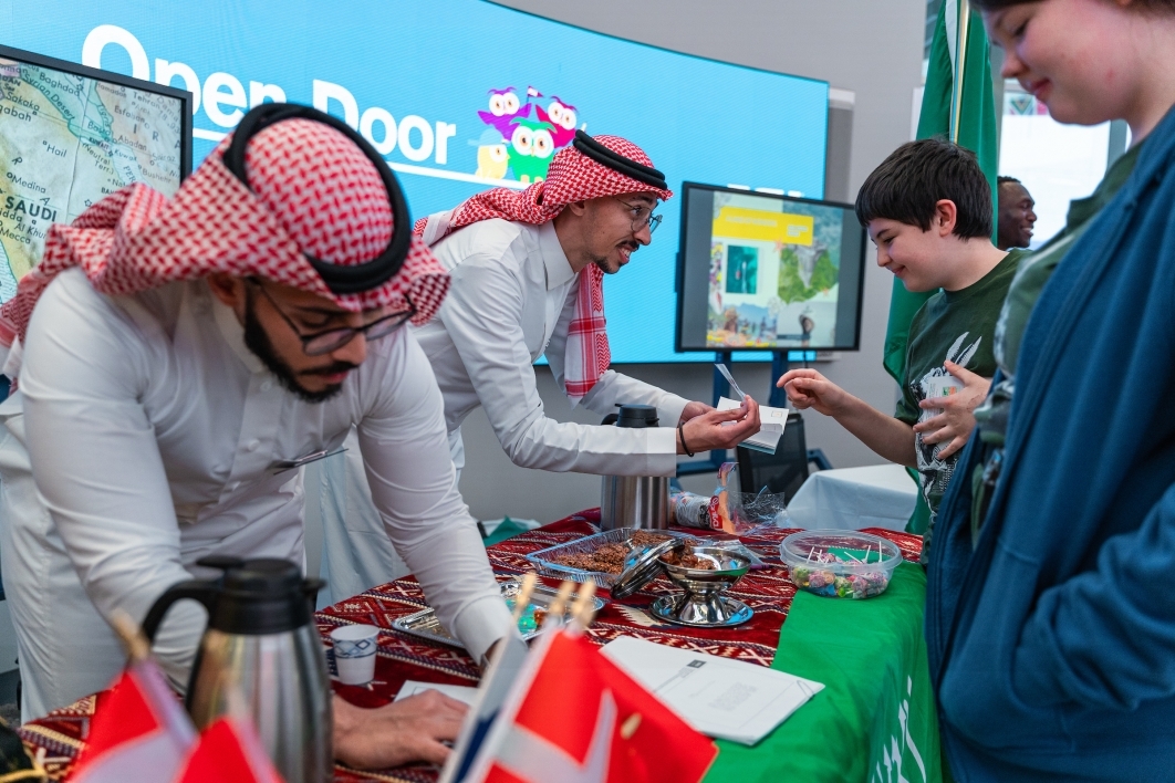 Attendees check out the Saudi Arabia tent at Open Door