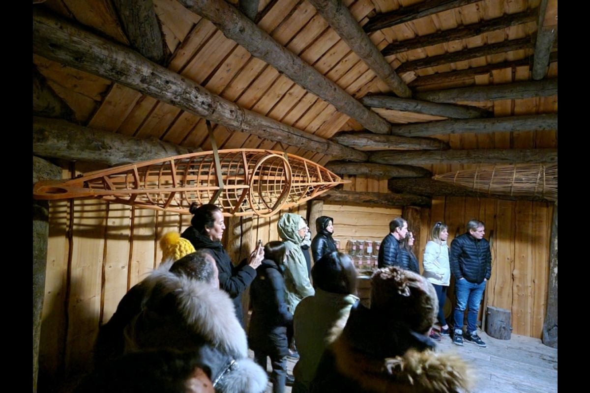 Group visiting log building in Alaska