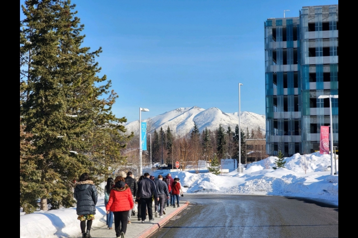 Students walking down street in Alaska