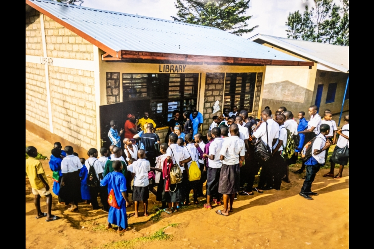 Students line up outside library building in rural Africa