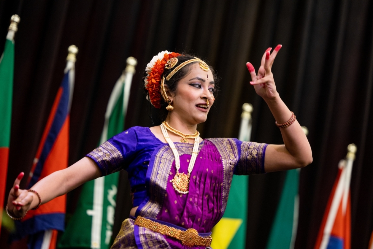 Woman performing Indian dance during gradation ceremony