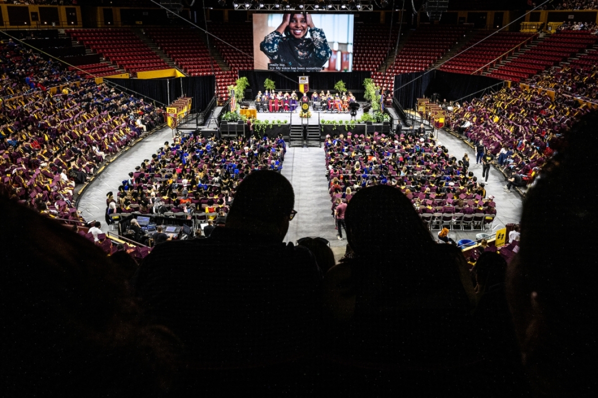 View of arena filled with graduates, family and friends
