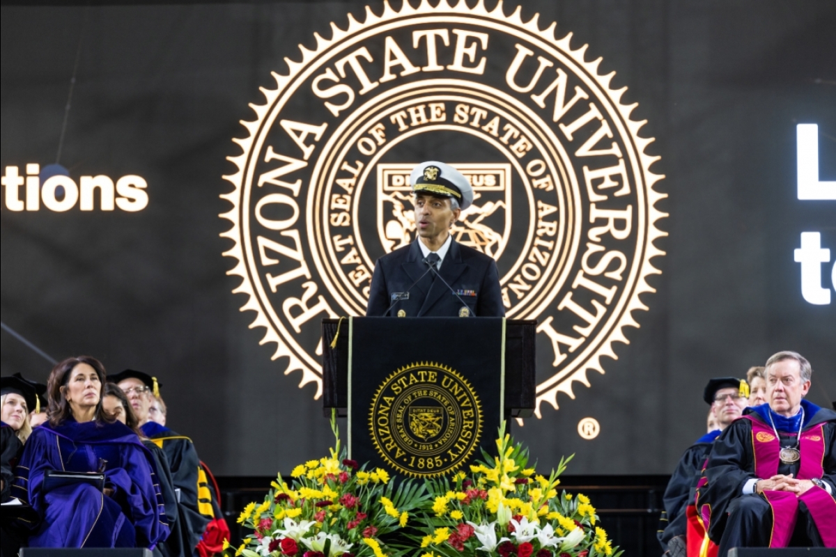US Surgeon General Vivek Murthy speaking at a lectern at ASU commencement