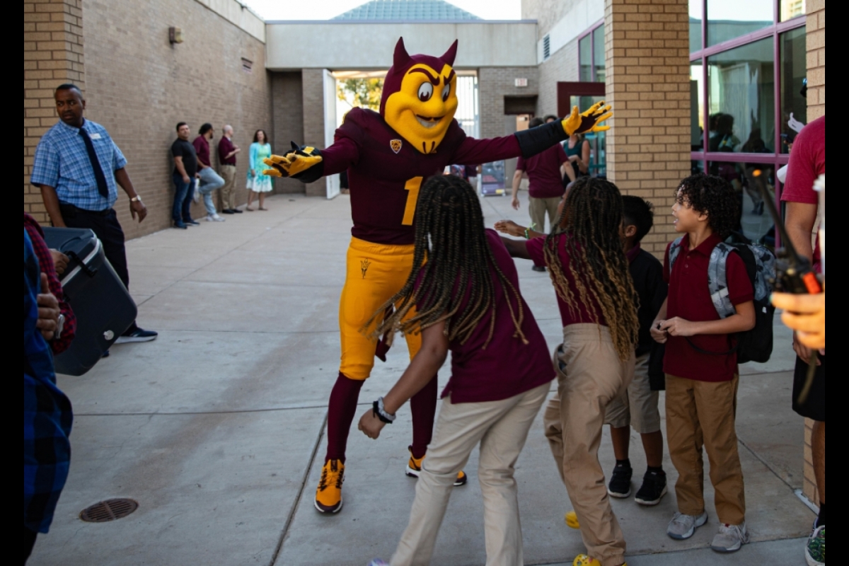 Sparky interacts with elementary students