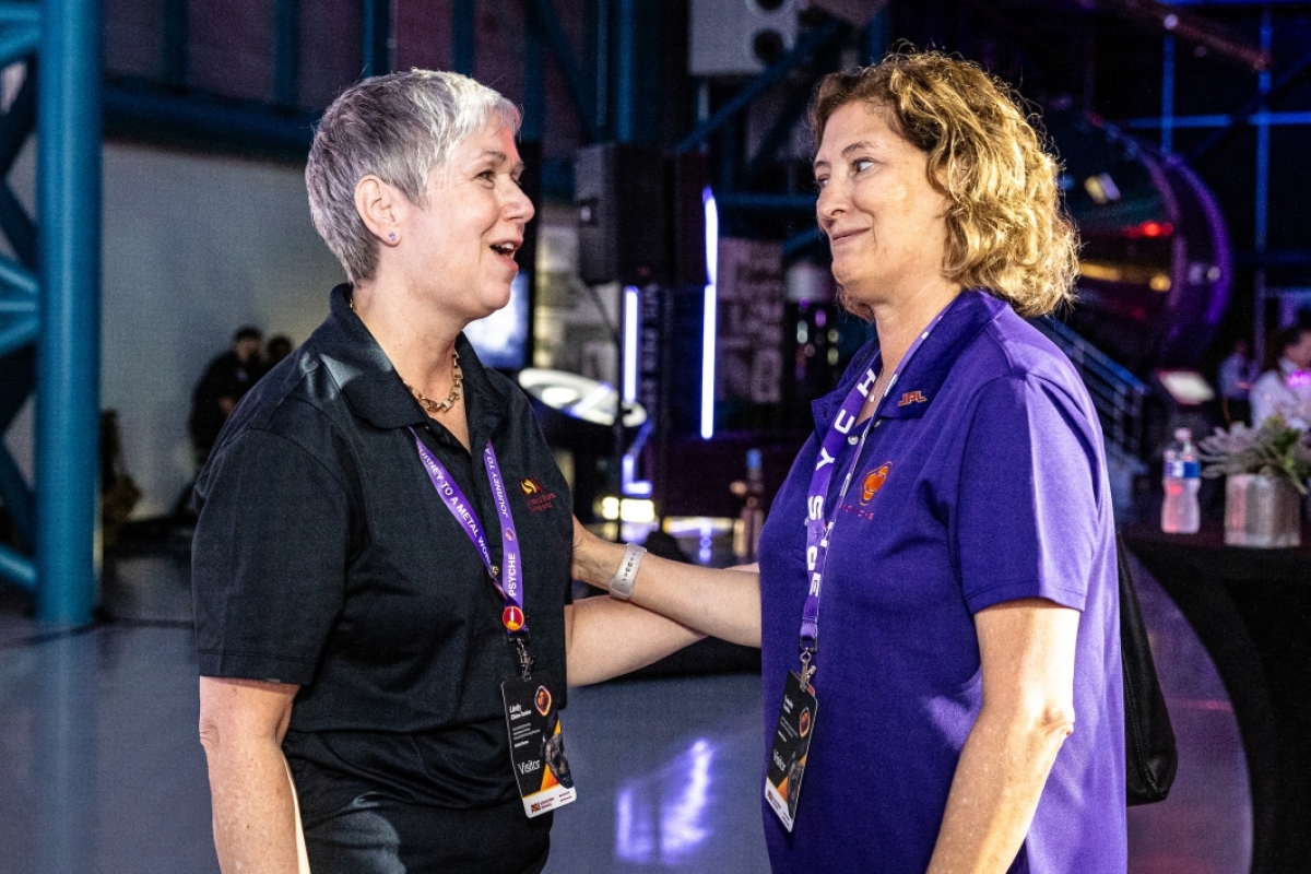 Psyche mission leader Lindy Elkins-Tanton and JPL Director Laurie Leshin smile at each other
