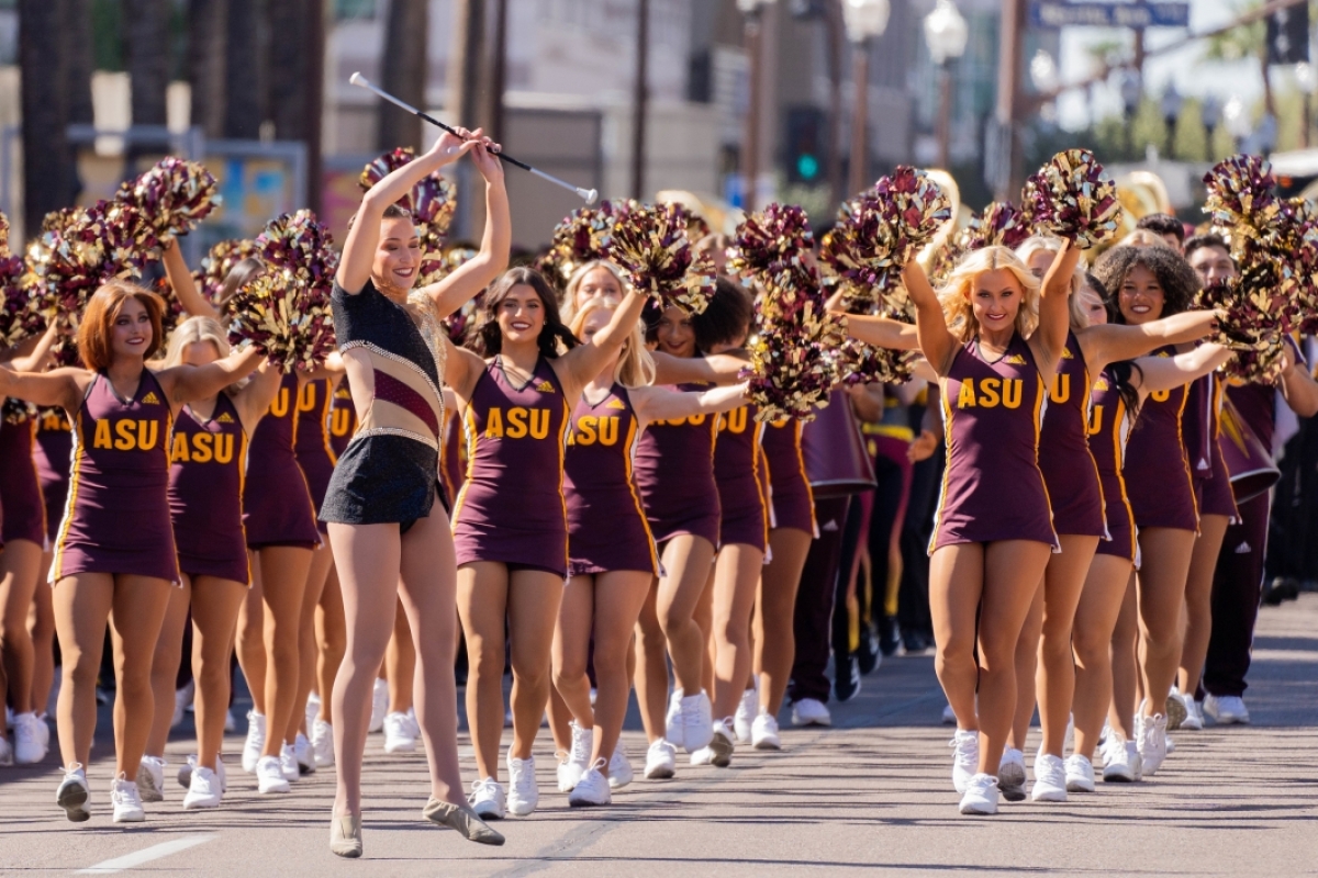 Cheerleaders marching in ASU Homecoming Parade