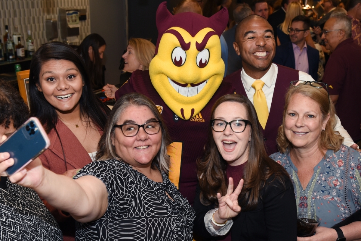 Group of Sun Devil 100 Class of 2023 members posing with Sparky.