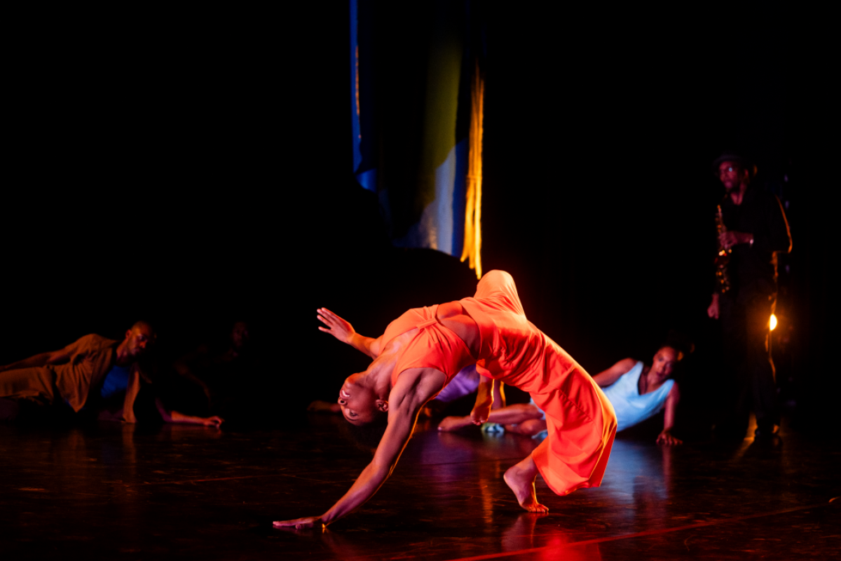 People performing dance on stage