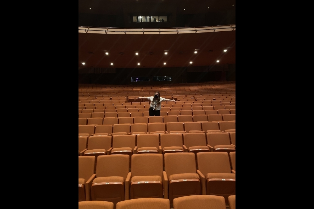Woman posing in empty Gammage auditorium