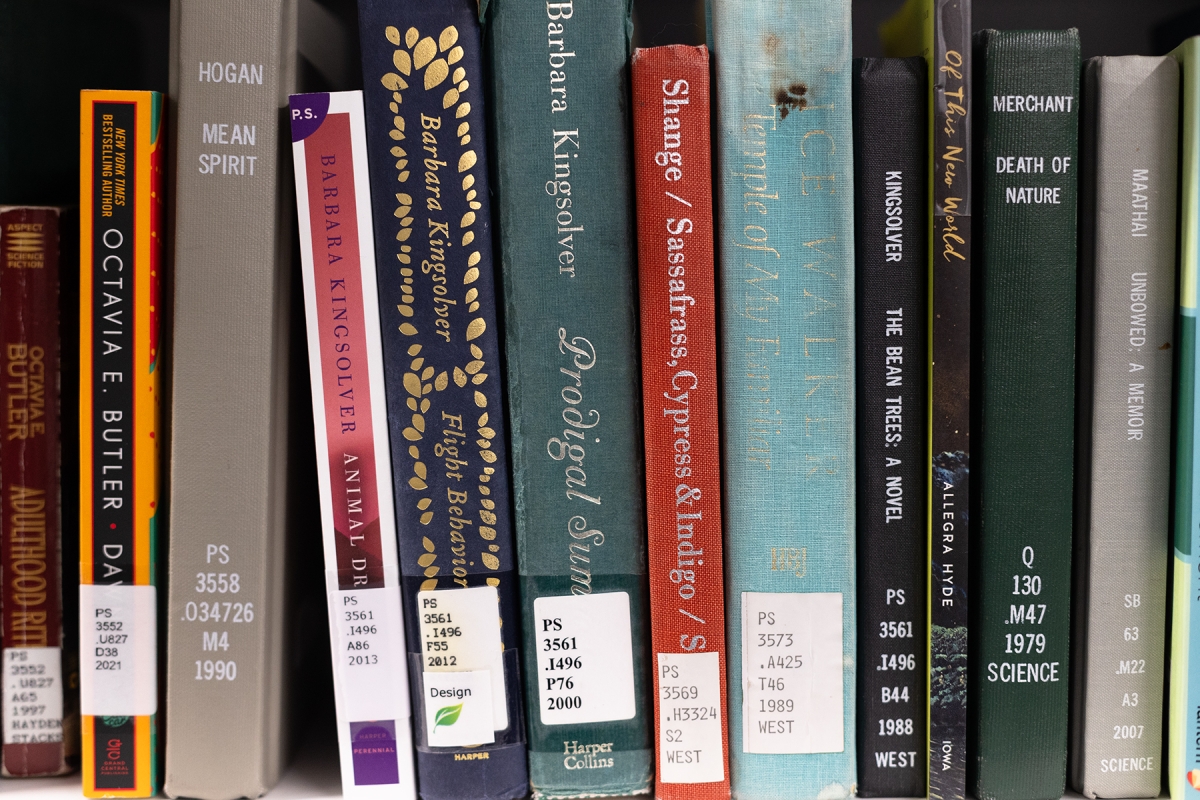 A close-up of book spines displayed on a shelf