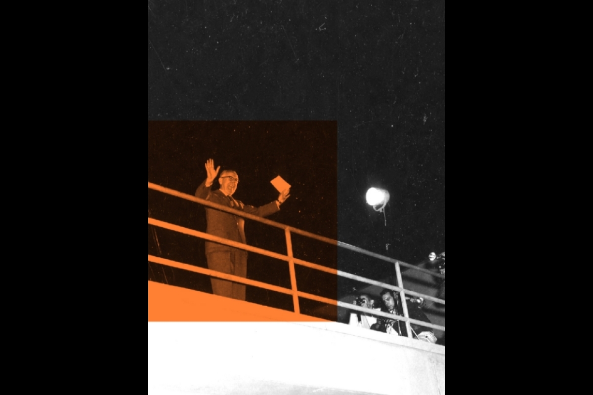 Stylized photo of man waving from balcony