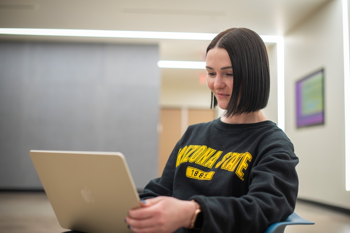 First-year doctoral student Kylie Frontczak on laptop