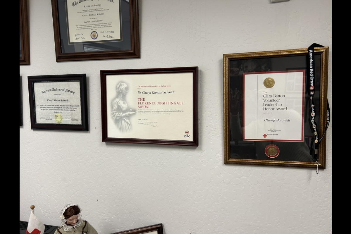 Awards framed on a wall.