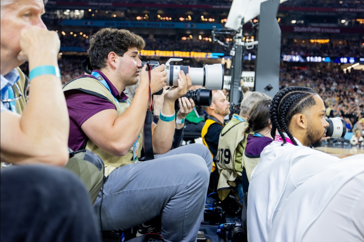 Student taking photos of Final Four game