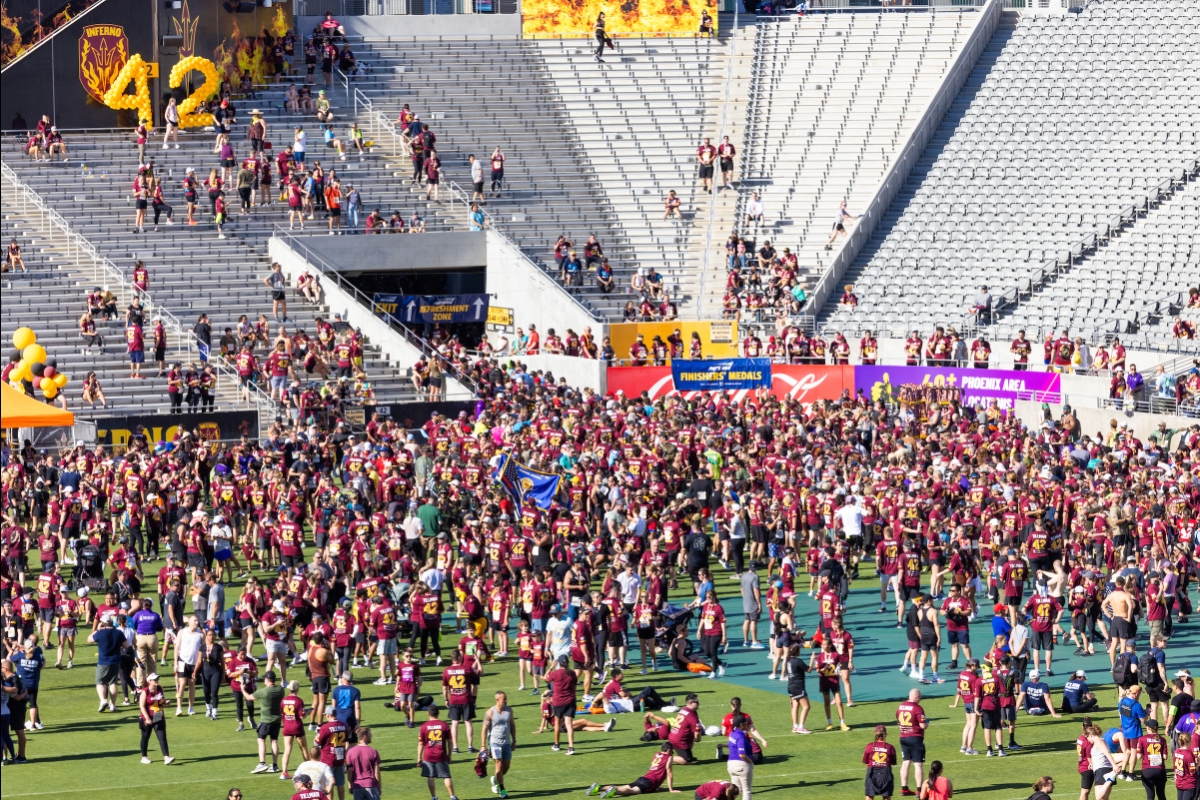 Large group of race participants on football field