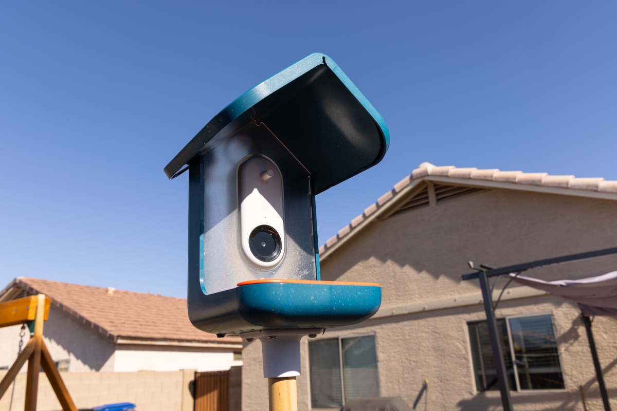 Photo of a bird feeder with a camera installed in it.