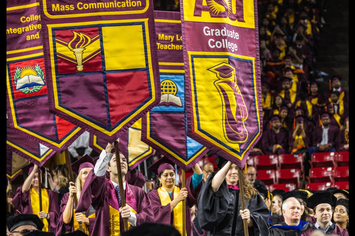 People carrying gonfalons into Graduate Commencement at ASU