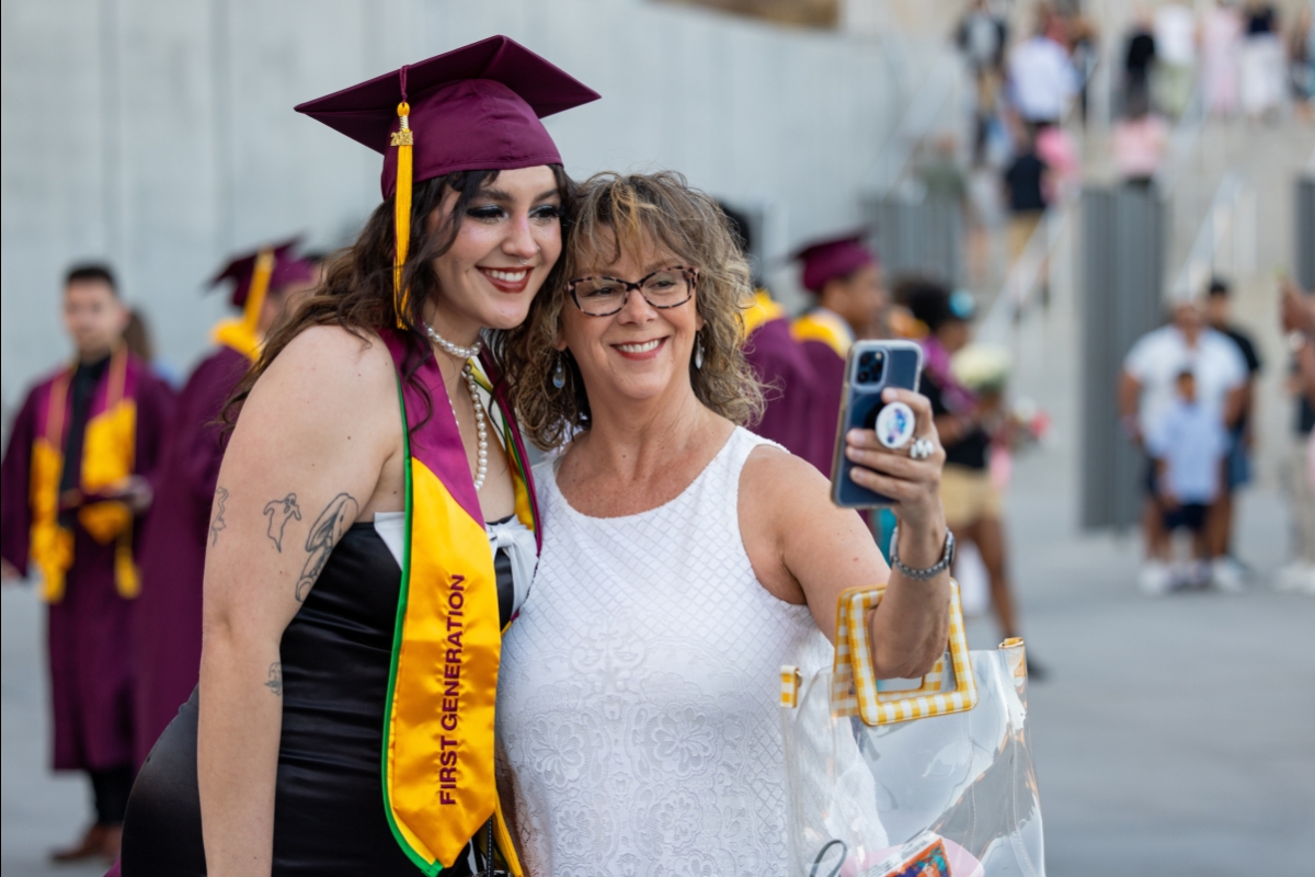 Mom and daughter pose for photo at ASU graduation