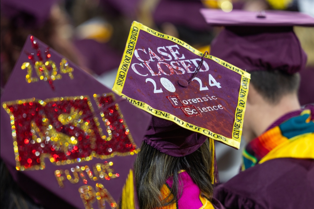 Decorated mortar board that says: Case Closed 2024