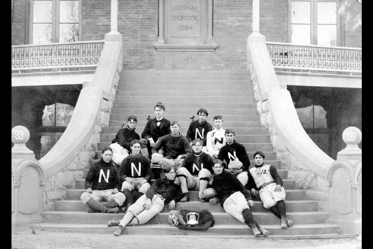 Historic photo of Tempe Normal football team posing on Old Main steps