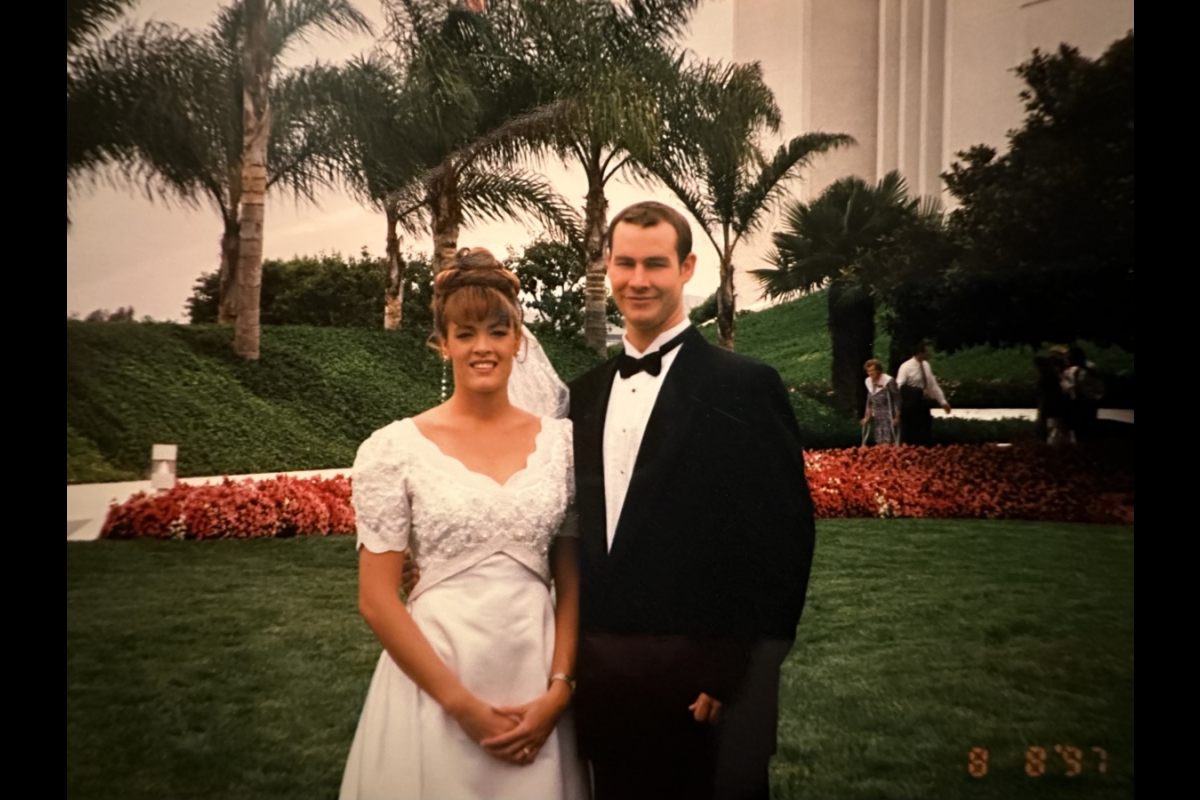 Photo from 1990s of married couple pictured outside on their wedding day 