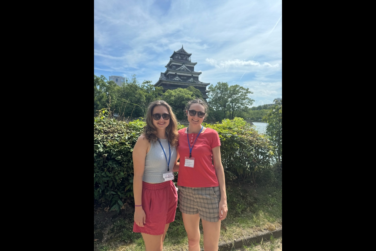 ASU students post for a photo in front of a Japanese structure.