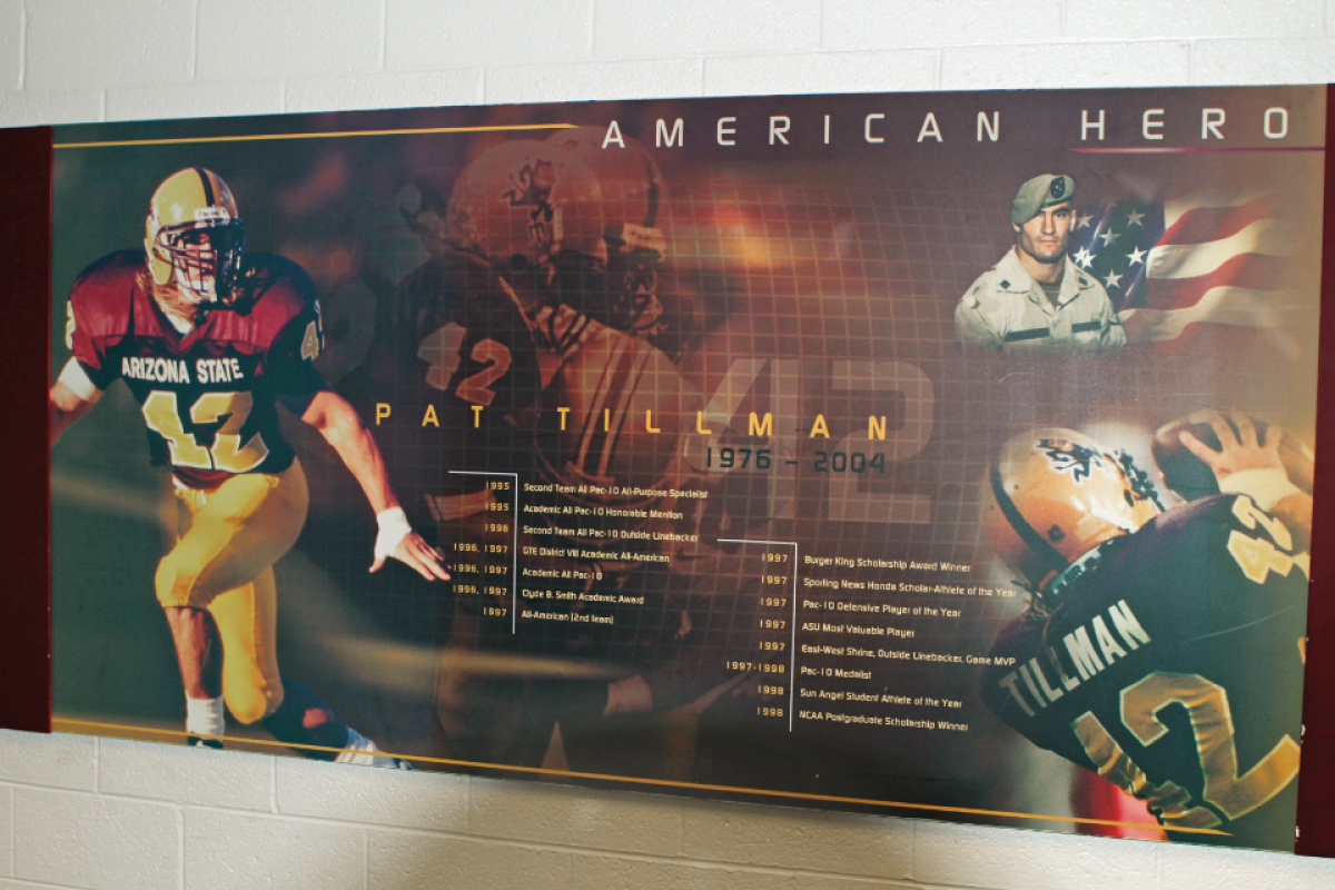 Wall display with photos of Pat Tillman and a timeline of his life