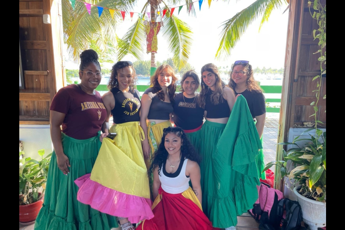 Group of students posing with their bomba dresses Photo courtesy of Karen Gregory-Mercado