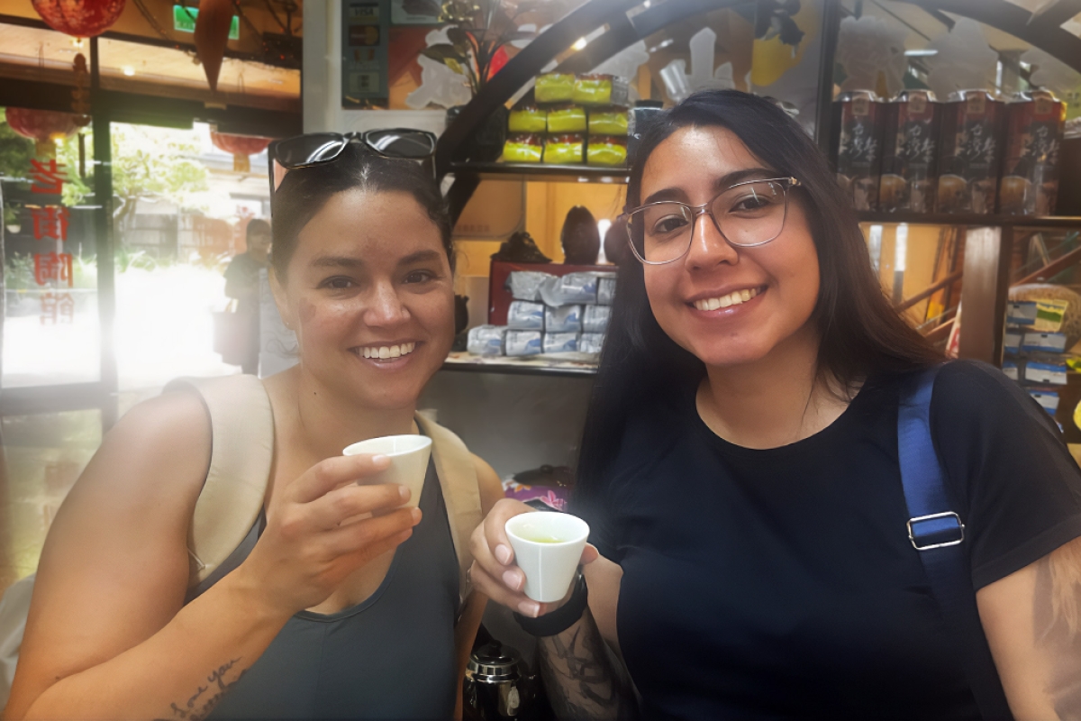 Two students drinking tea in the Yingge District of Taiwan.