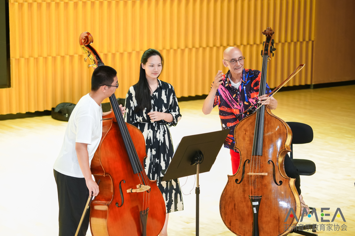 Group of three people playing instruments