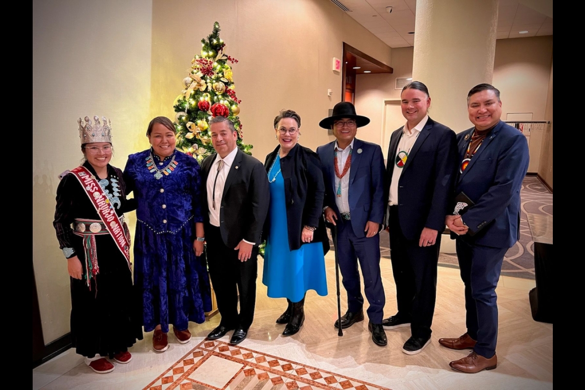 Amy N. Begaye standing with Navajo Nation delegates and President Buu Nygren. Courtesy of Amy N. Begaye.