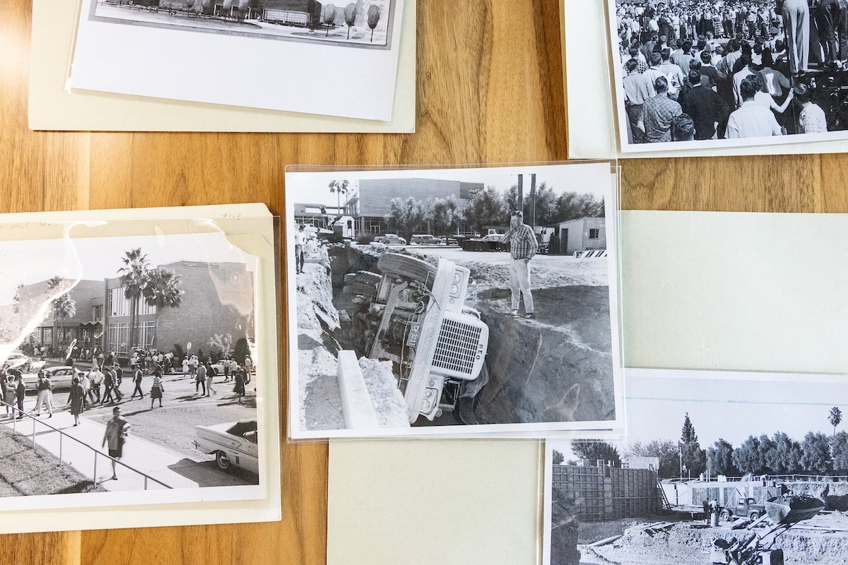 Black-and-white photos on a table.