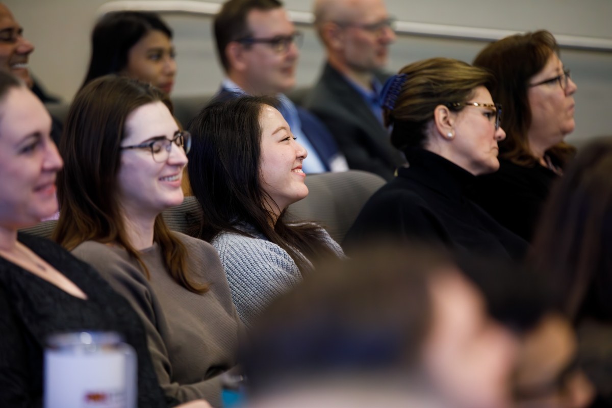 Portrait of audience at an event.